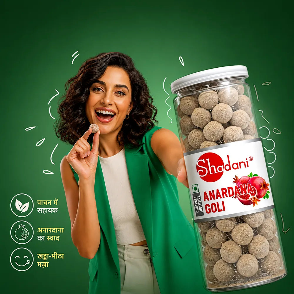 Woman holding a jar of Shadani Anardana Goli against a green background