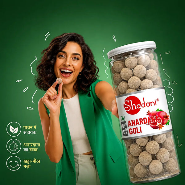 Woman holding a jar of Shadani Anardana Goli against a green background