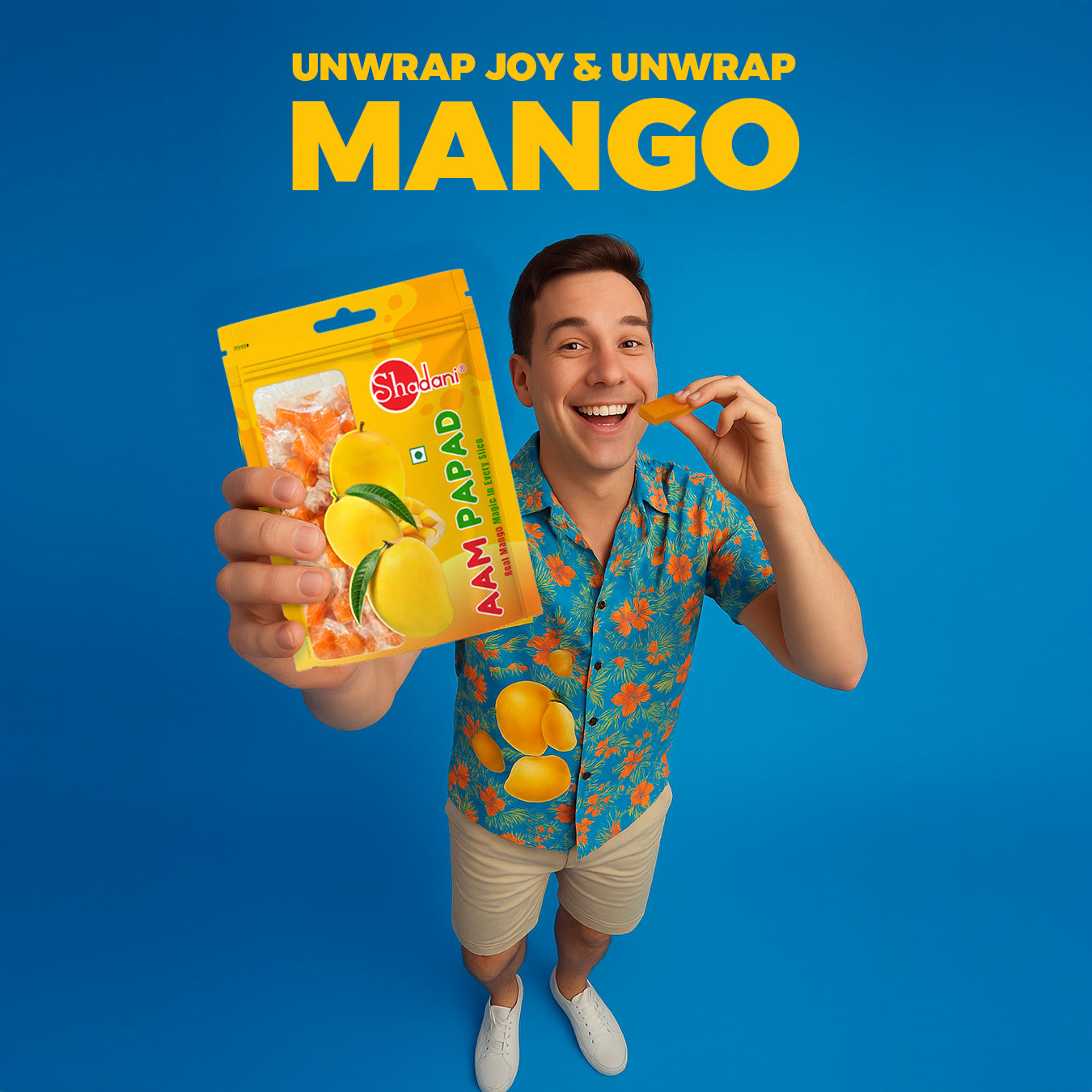 Man holding a packet of 'Shadani' mango snacks against a blue background with promotional text.