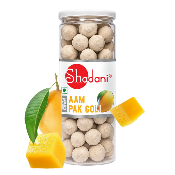 Jar of Shadani Aam Pak Goli with mangoes and a leaf on a white background