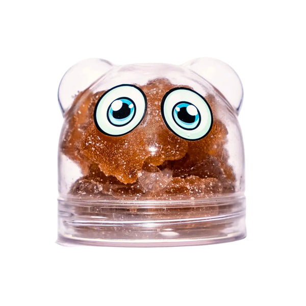 A bear-shaped shadani cola candy with a clear body revealing the individual candy pieces inside, with eyes on the top of the bear's head.