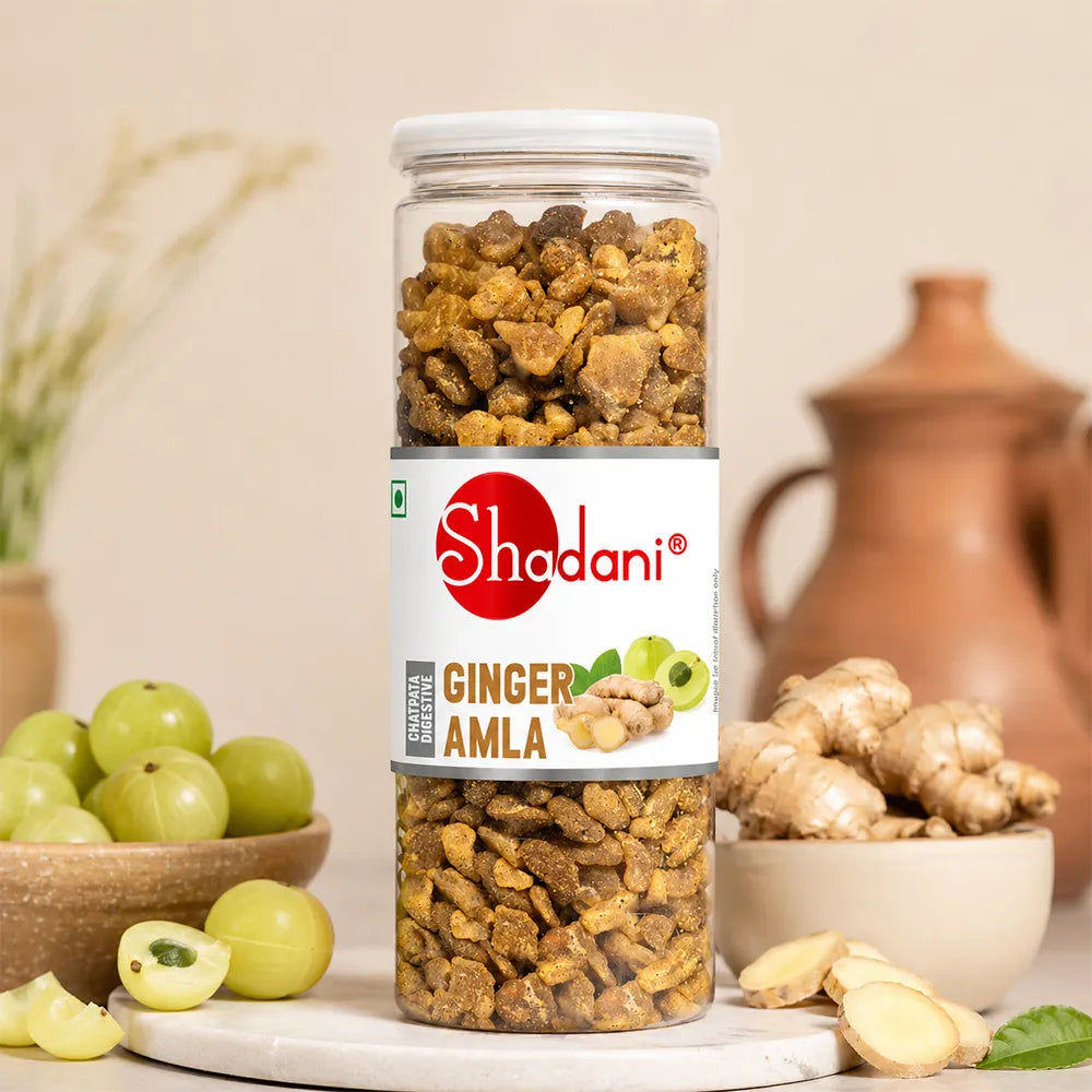 Can of Shodani Ginger Amla with ginger and amla fruits on a neutral background