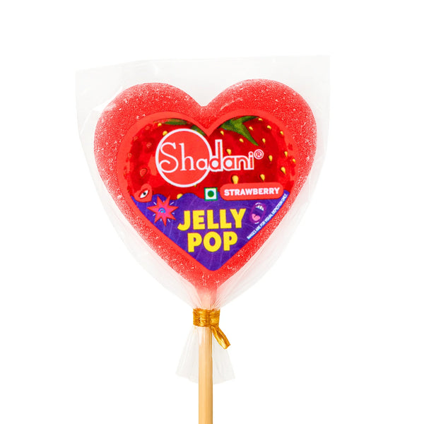 Heart-shaped Shadani jelly lollipop on a stick with strawberry flavor label.
