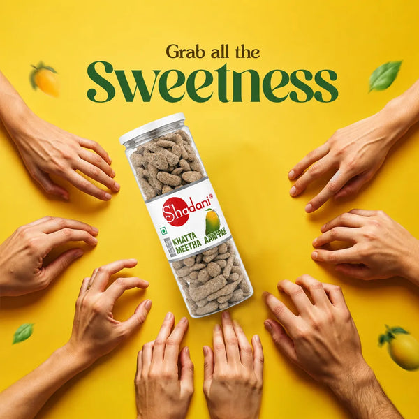 Shadani khatta meetha aampak bottle surrounded by hands on a yellow background with 'Grab all the Sweetness' text.