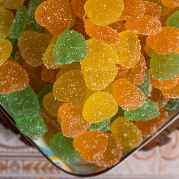 Close-up of colorful shadani jelly candy gummy bears in a container