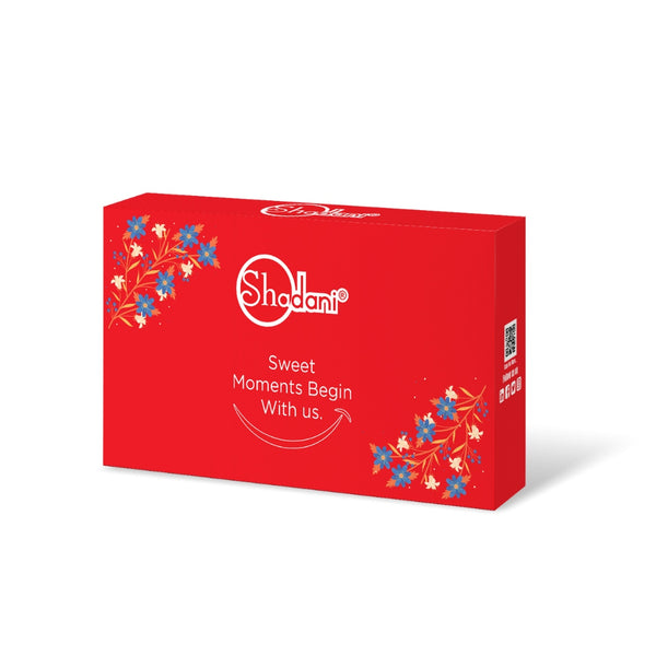 Red Shodani chocolate box with floral designs on a white background