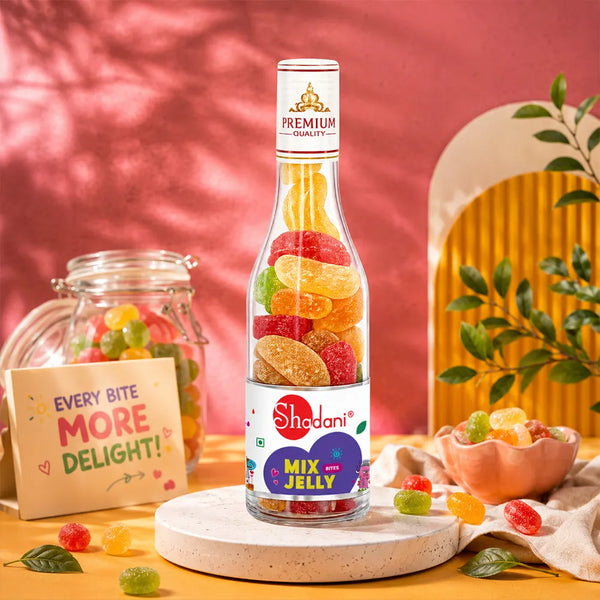 Bottle of Shadan Mix Jelly with colorful jelly candies on a wooden surface against a pink background.