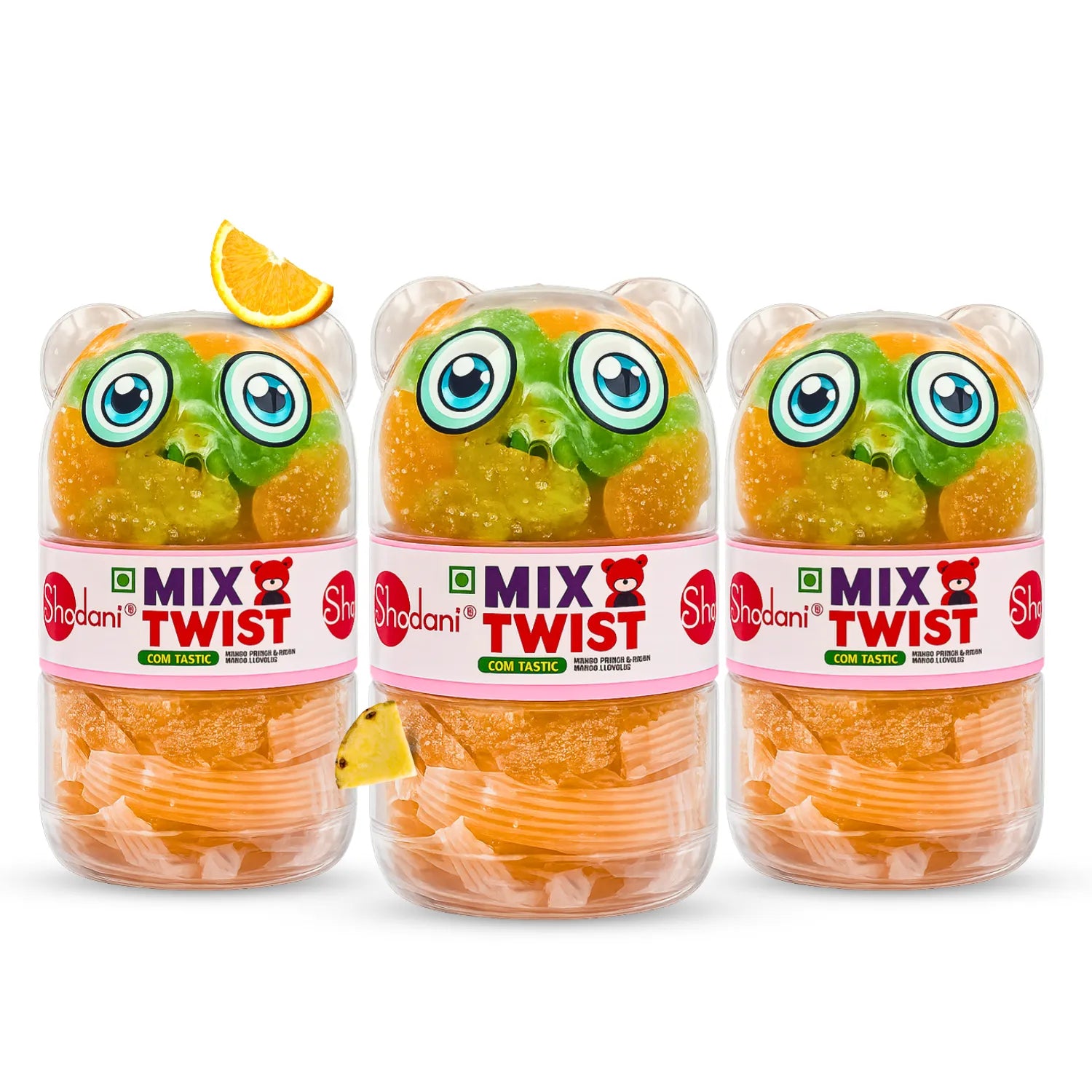 Three Shadani Mix Twist gummy bear jars arranged side by side on a white background, with orange gummy bears visible through the clear jars and decorative citrus slices near the top.