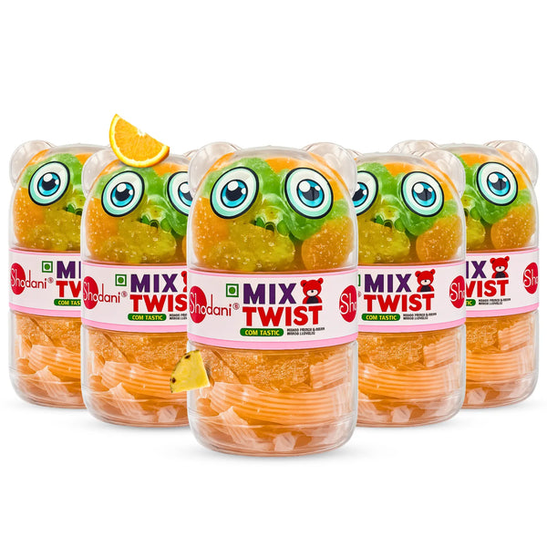 Five bottles of Shadani Mix Twist Sour Candy arranged in a row on a white background, with two bottles showing the orange sour candy inside and the others showing the colorful cartoon frog packaging.