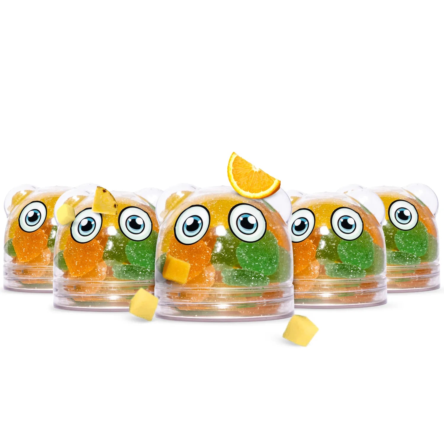 Five clear shadani domed candy containers with cartoon eyes and colorful gummy candies inside, arranged on a white background with a few loose yellow candies and a lemon slice garnish.