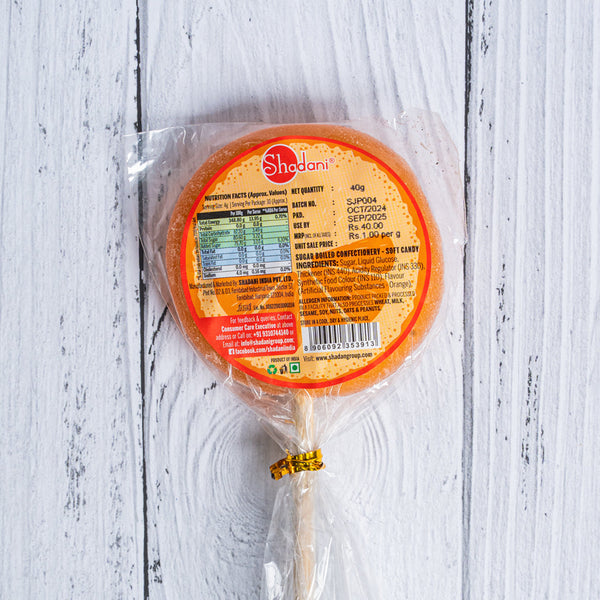 Packaged round product with a label on a white wooden surface