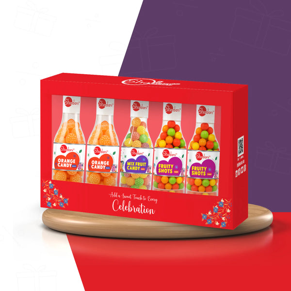 Red gift box with candy packages on a red and purple background