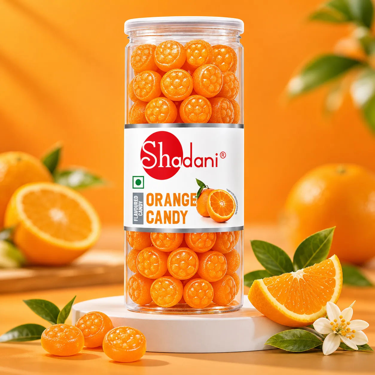 Can of Shadani Orange Candy with oranges and leaves on a wooden surface