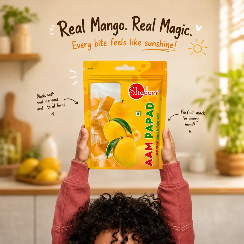 Real Mango Real Magic Every bite feels like sunshine text on image and the a childern picked the aam papad pouch in his hand 