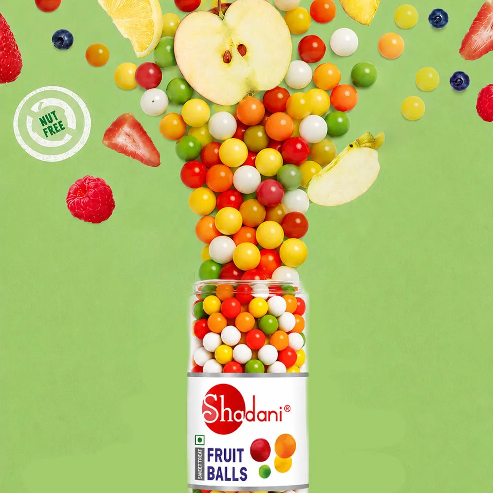 Shadani Fruit Balls packaging with colorful fruit balls spilling out on a green background