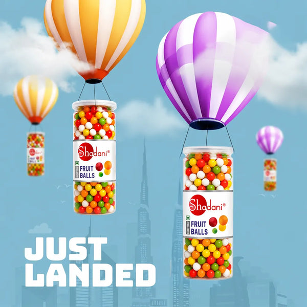 Shadani fruit balls packaging with hot air balloons against a city skyline background